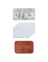 A Maine crafted Tradevia brown American Bison leather Bison Card Case with a dollar bill and a credit card.