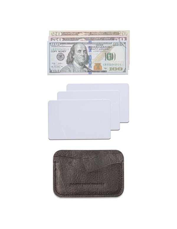 A Tradevia Bison Card Case with a dollar bill and a credit card.