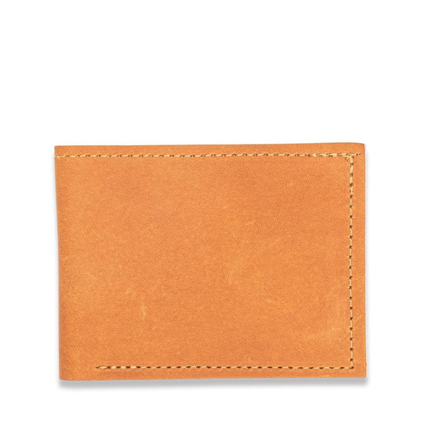 A Heritage Wallet in Baseball Glove Leather by Tradevia on a white background.