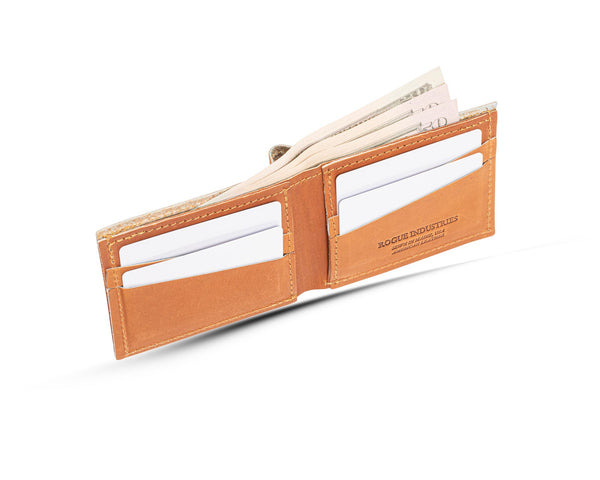 A Heritage Wallet in Baseball Glove Leather by Tradevia with money in it, made in the USA.