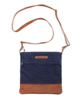 A blue and brown waxed canvas Ellis River crossbody bag by Tradevia.