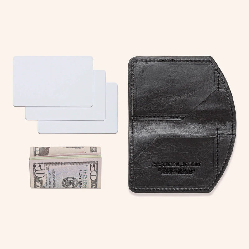 A black Tradevia Chamberlain Belt and Minimalist Wallet Bundle with a dollar bill and a credit card.