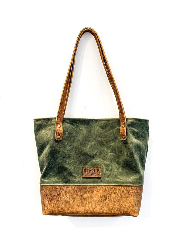 A green and tan waxed canvas and leather Saco River tote bag by Tradevia.