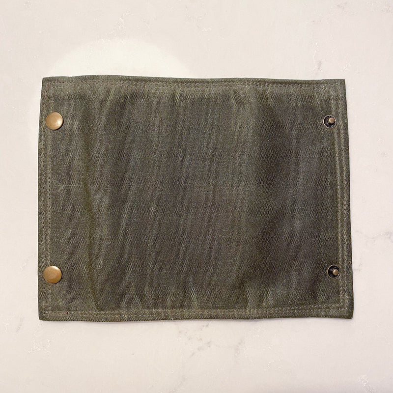 A close up of a Tradevia Rogue River Fly Fishing Wallet.