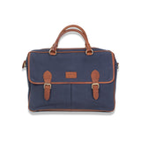 The durable navy and tan leather Tradevia waxed canvas laptop bag is on a white background.