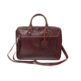 A brown genuine leather West End Slim Leather Laptop Bag by Tradevia with a removable strap.